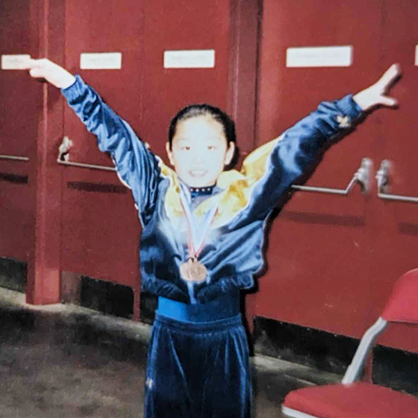 Sara celebrating her gymnastic medals